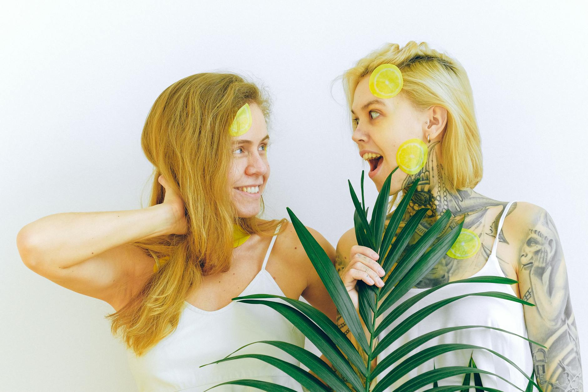 Two women smiling together, expressing comfort and joy around conversations about pleasure and toys.